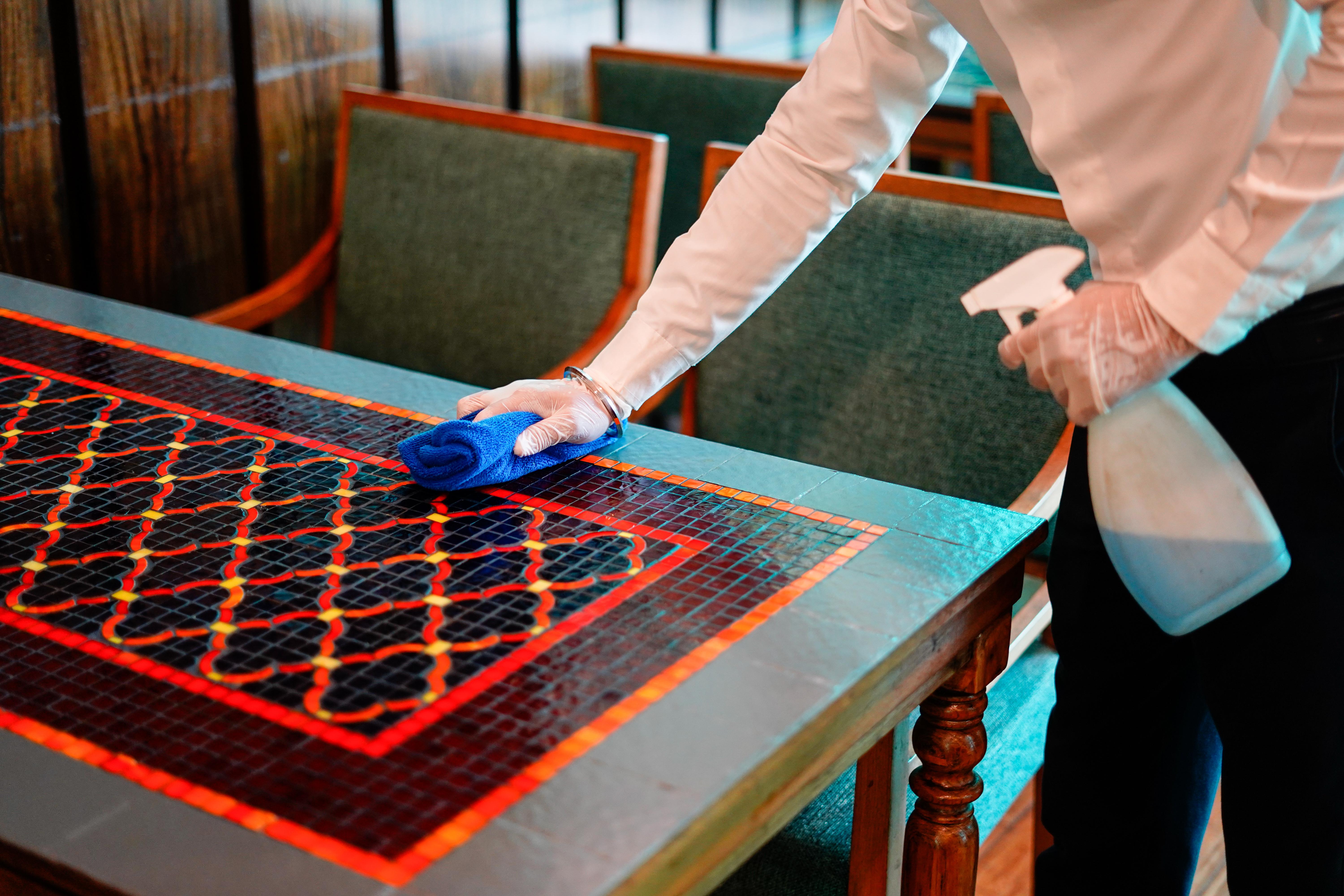 Novotel Goa Resort & Spa Candolim Εξωτερικό φωτογραφία A hotel housekeeper wiping down a table