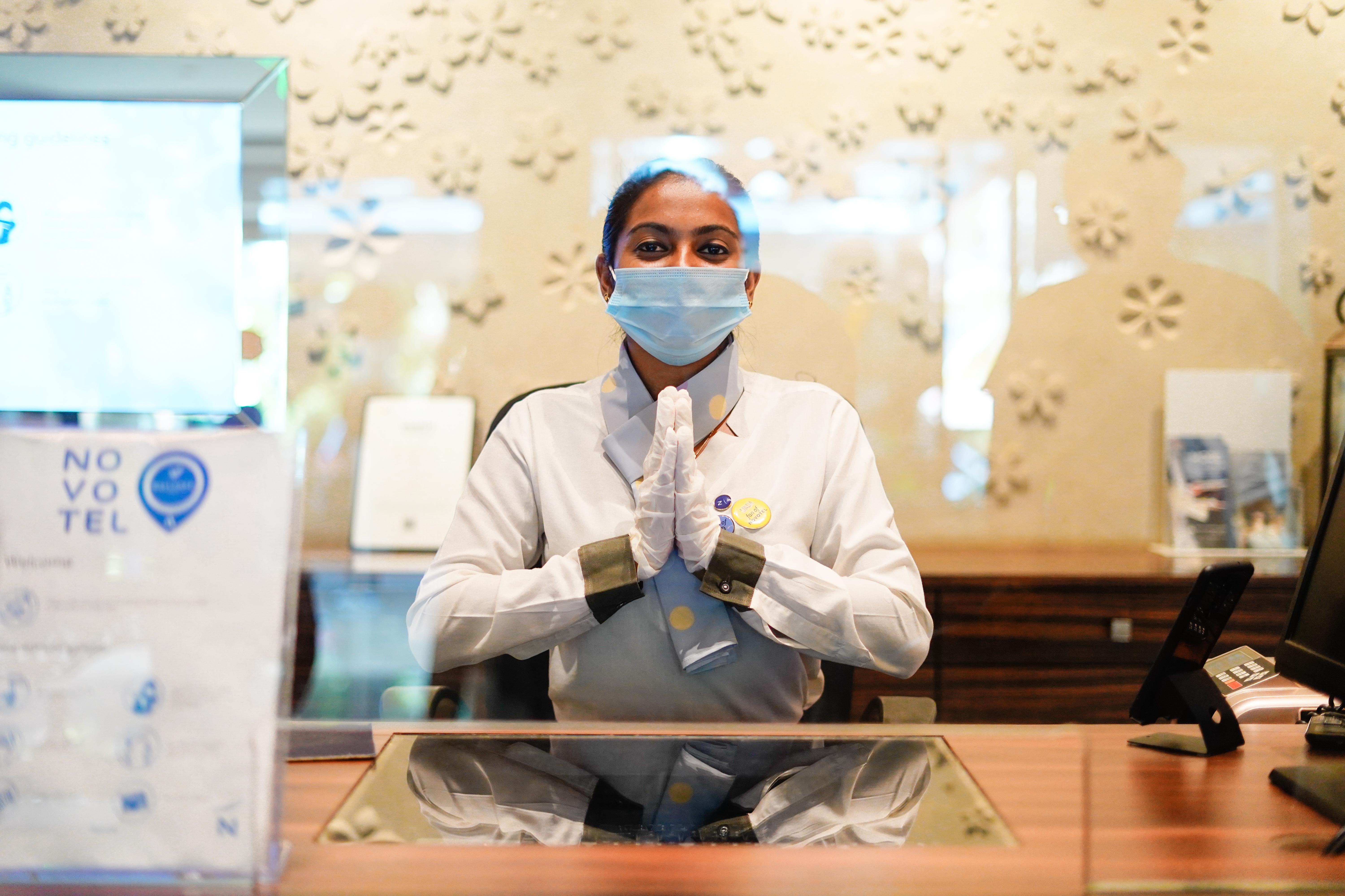 Novotel Goa Resort & Spa Candolim Εξωτερικό φωτογραφία A hotel employee wearing a face mask