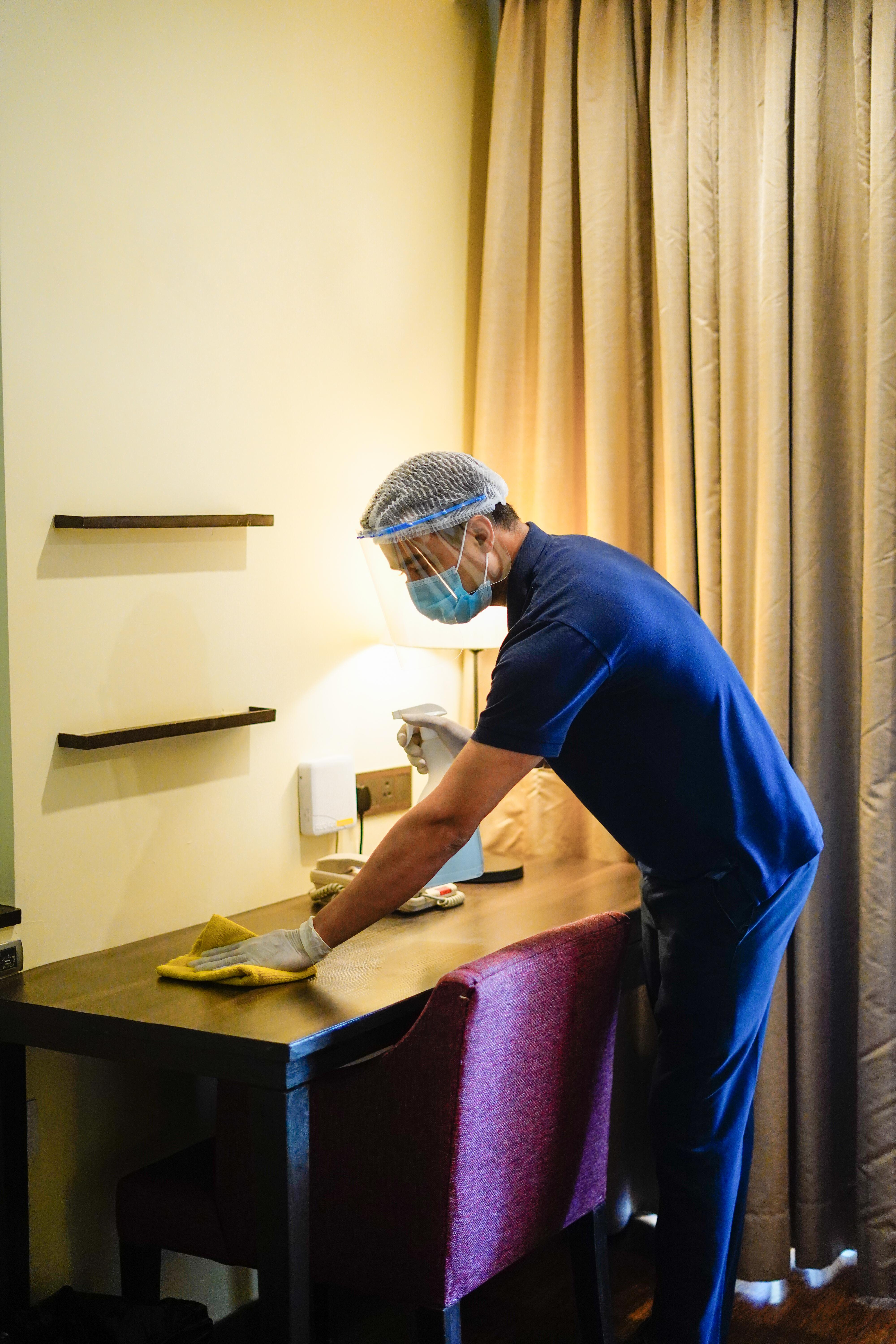 Novotel Goa Resort & Spa Candolim Εξωτερικό φωτογραφία A hotel housekeeper wearing a face shield and gloves